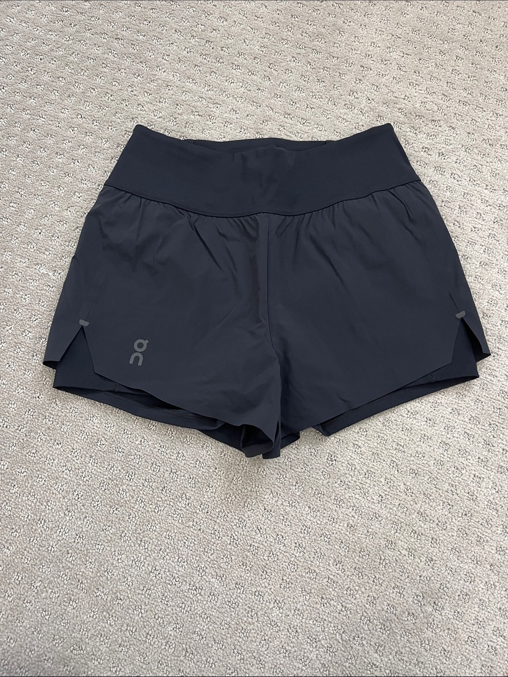 On Running Women's Black Athletic Split-Hem Running Shorts with base layer